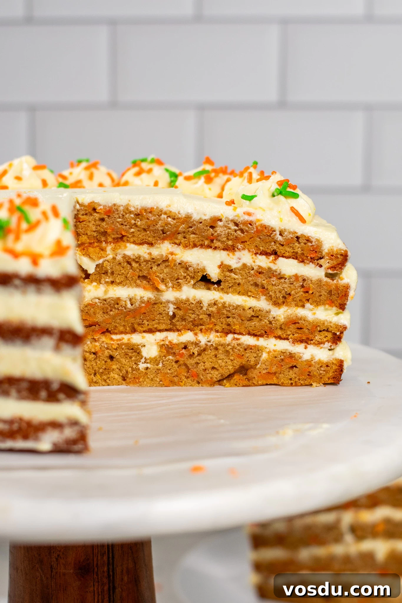 Classic Danish Carrot Cake Recipe with Cream Cheese Frosting 7 A closeup of a carrot cake cross section.