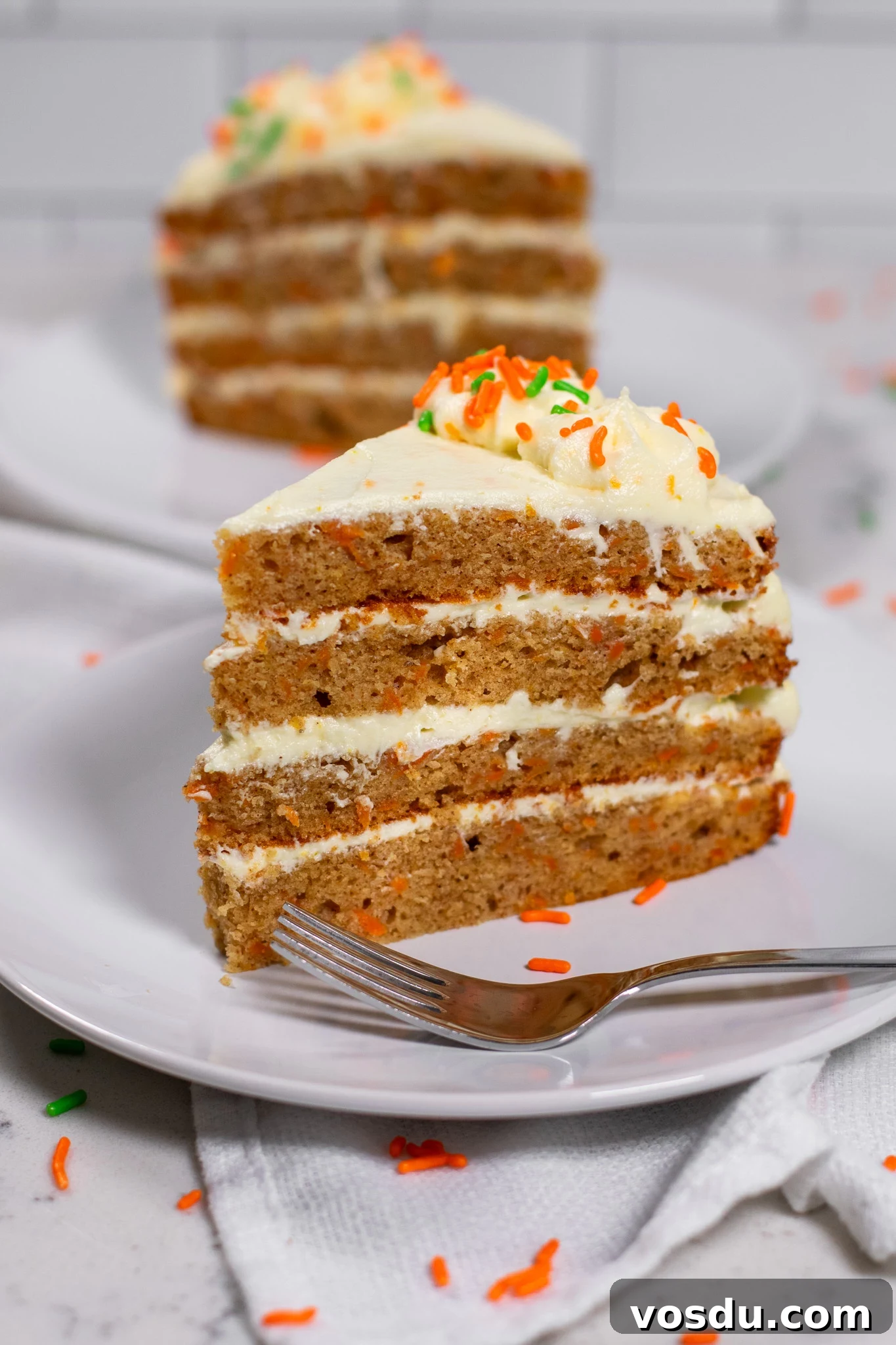 Classic Danish Carrot Cake Recipe with Cream Cheese Frosting 8 A slice of carrot cake.