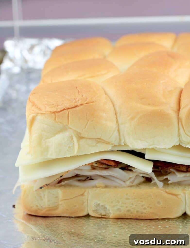 Maple Bacon Turkey Slakers on Hawaiian Rolls 8 side view of the fully assembled turkey sliders on Hawaiian rollssliders