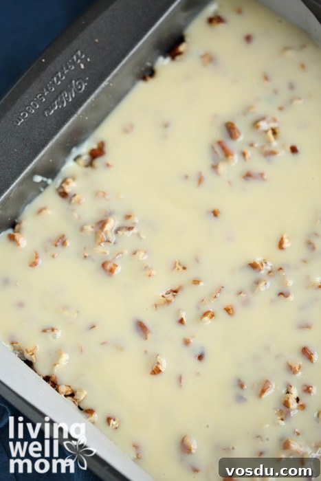 Classic Seven-Layer Bars Recipe with Chocolate and Nuts 9 sweetened condensed milk poured over seven layer bars
