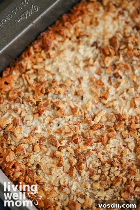 Classic Seven-Layer Bars Recipe with Chocolate and Nuts 10 all the ingredients cooked in a pan