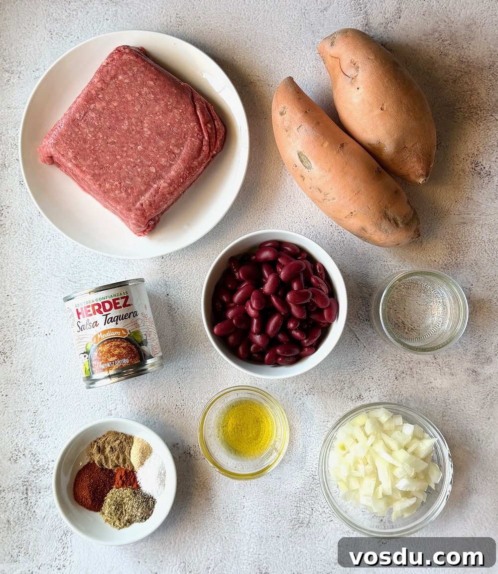 Taco-Stuffed Baked Sweet Potatoes — Savory Comfort Meal 3 Ingredients displayed for baked sweet potatoes stuffed with taco meat. Ground beef, sweet potatoes, kidney beans, water, salsa, oil, onions, taco seasonings.