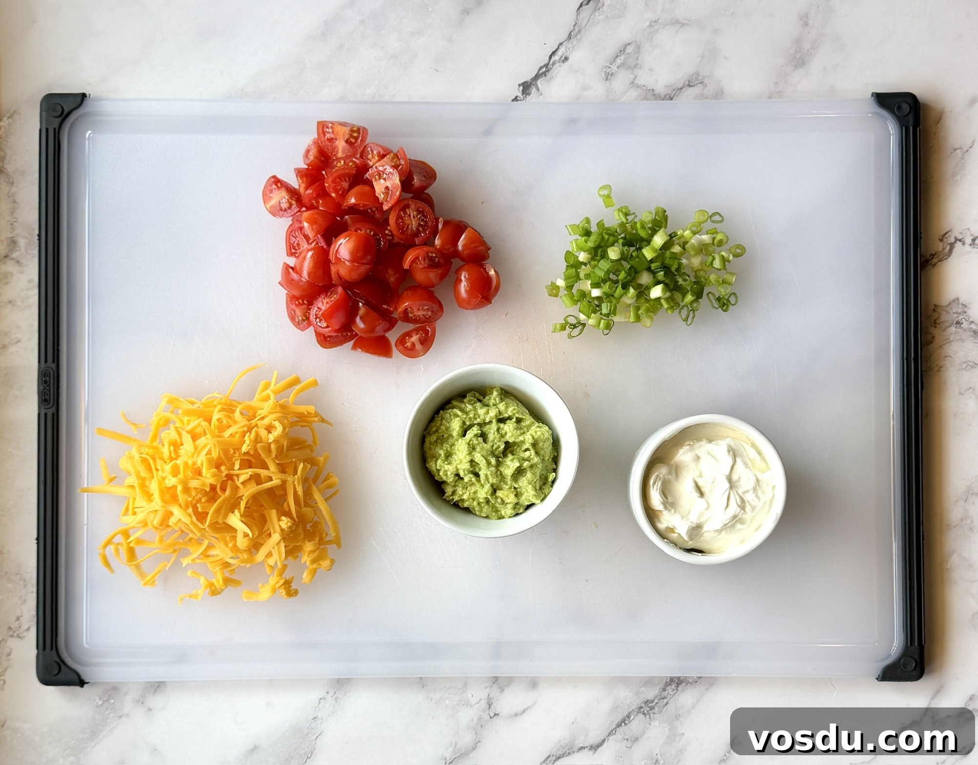 Taco-Stuffed Baked Sweet Potatoes — Savory Comfort Meal 8 Toppings for taco sweet potatoes--tomatoes, green onions, sour cream, smashed avocado, and cheese.
