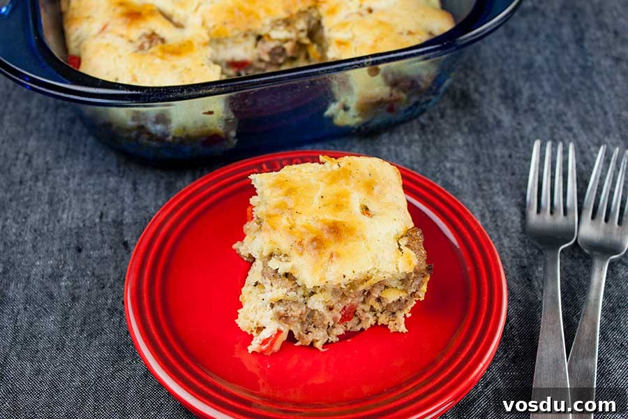 Savory Sausage Breakfast Cake Recipe for Brunch and Meal Prep 5 Sausage Breakfast Cake Recipe - serving of sausage cake on a red plate