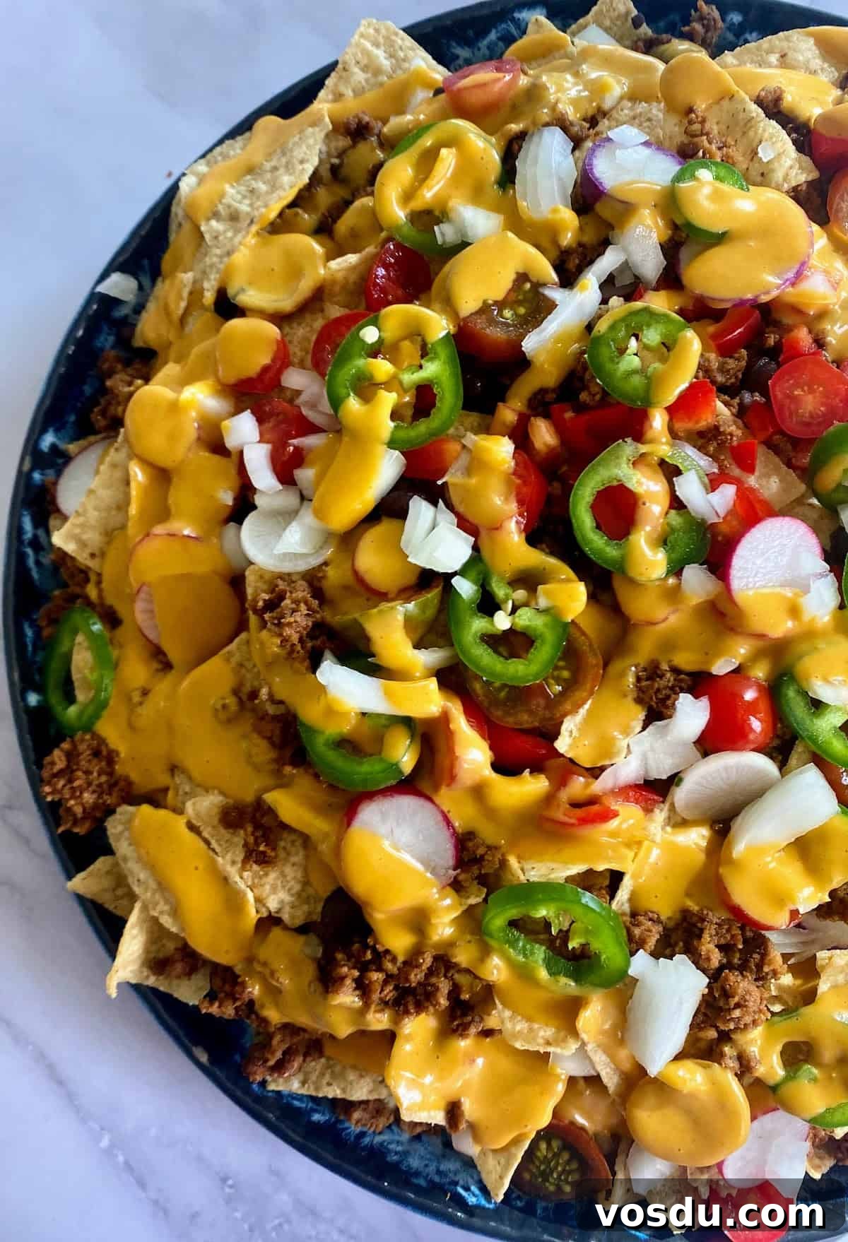 Crunchy Vegan Nachos with Spicy Cashew Cheese 2 Vegan nachos served on a platter