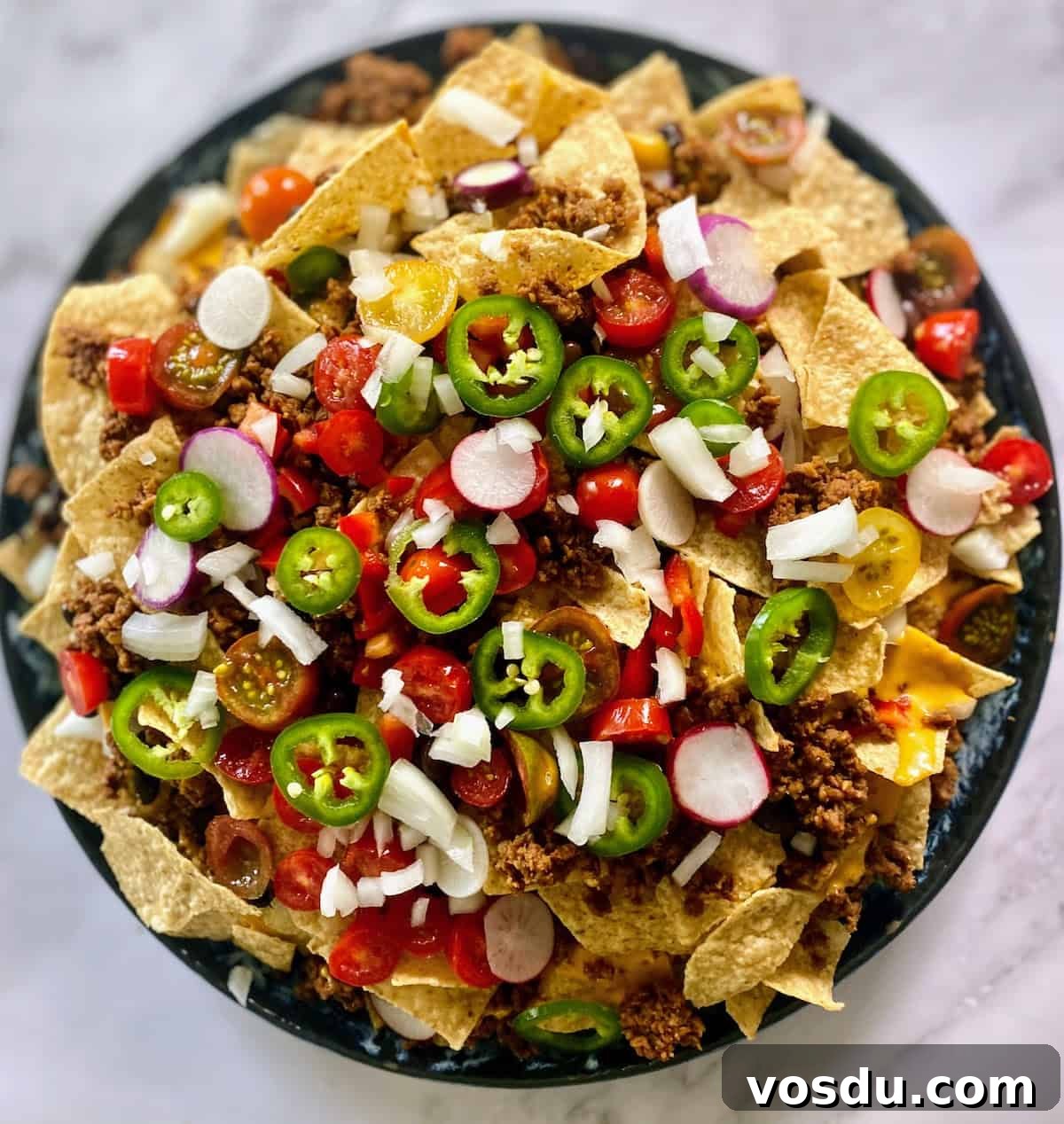 Crunchy Vegan Nachos with Spicy Cashew Cheese 8 Layering the nacho ingredients