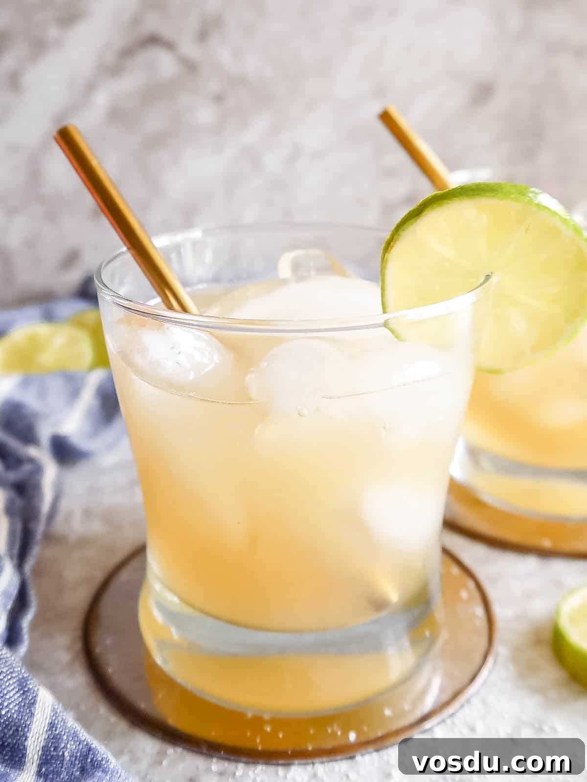 Cointreau Margarita Recipe: Classic Cocktail Guide and Tips 2 Up close glass of Cointreau Margarita with a lime on the rim.