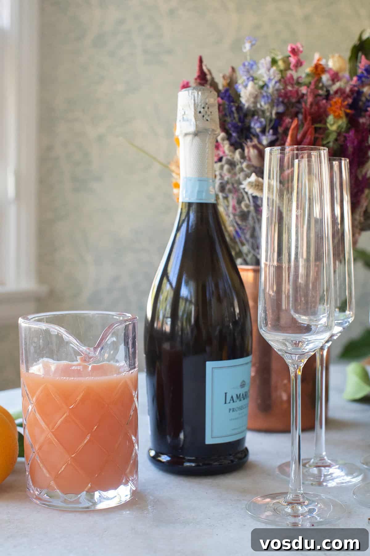 Citrus Grapefruit Mimosa Recipe — Bright Brunch Cocktail 3 Prosecco, grapefruit juice and an orange.
