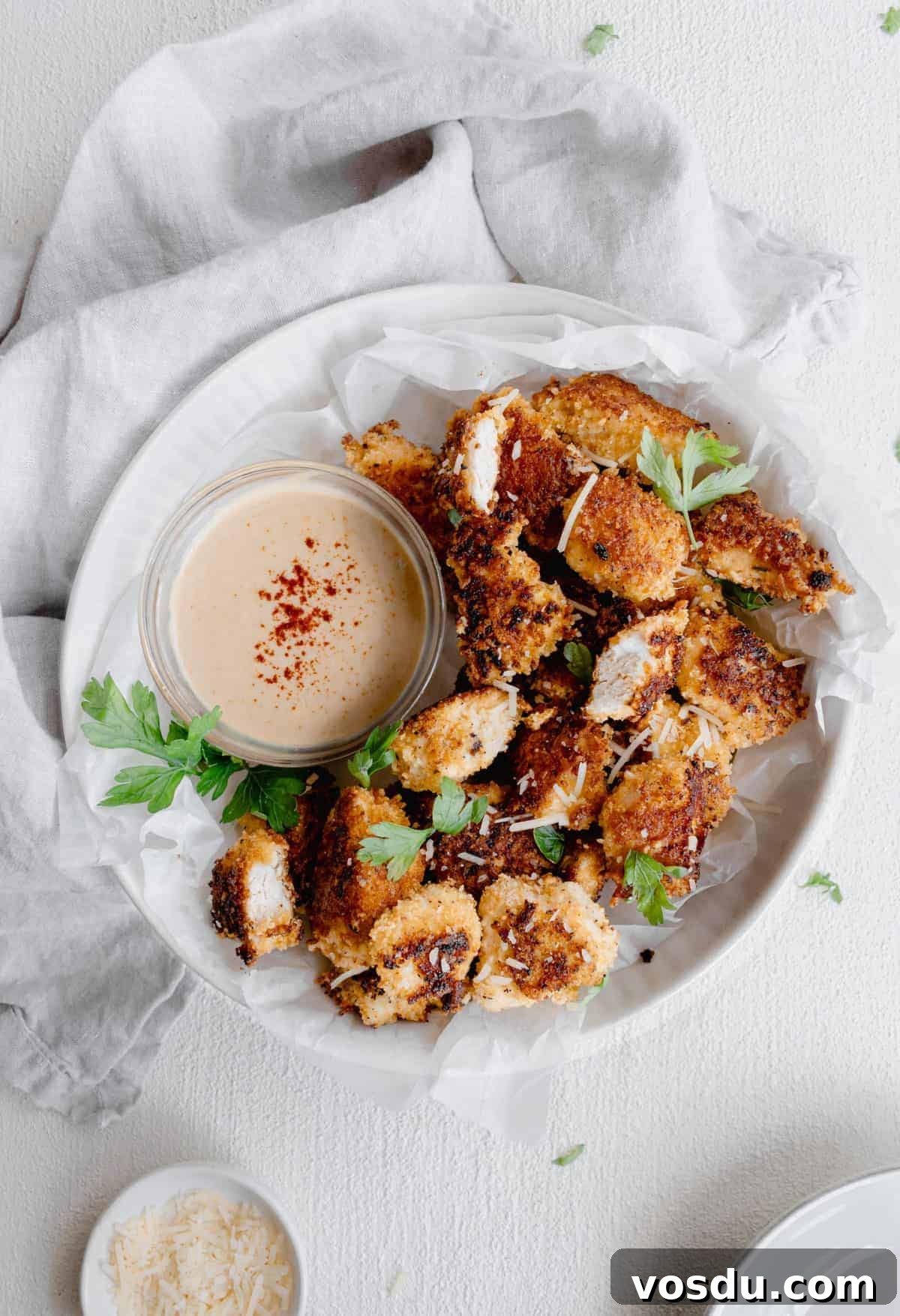 chicken nuggets on plate.