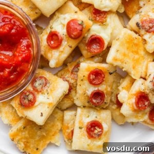 Close-up of mini cheese and pepperoni pizza bites.