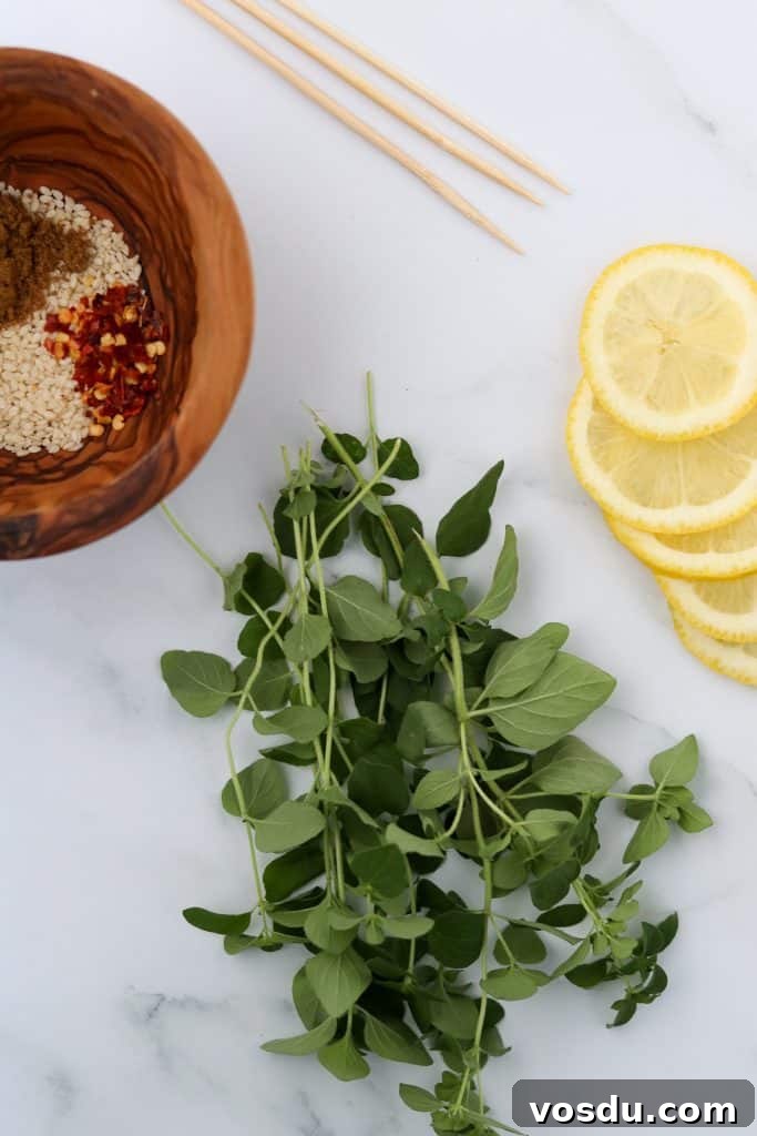 Lemon-Spiced Salmon Skewers with Herb Marinade 3 Fresh herbs, lemon slices and a bowl of spices