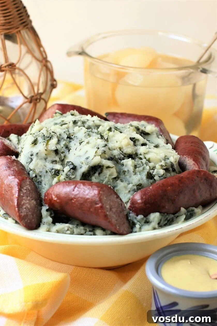 Dutch Kale Stamppot with Sausage — Classic Dutch Comfort Meal 6 boerenkool in serving dish, light background
