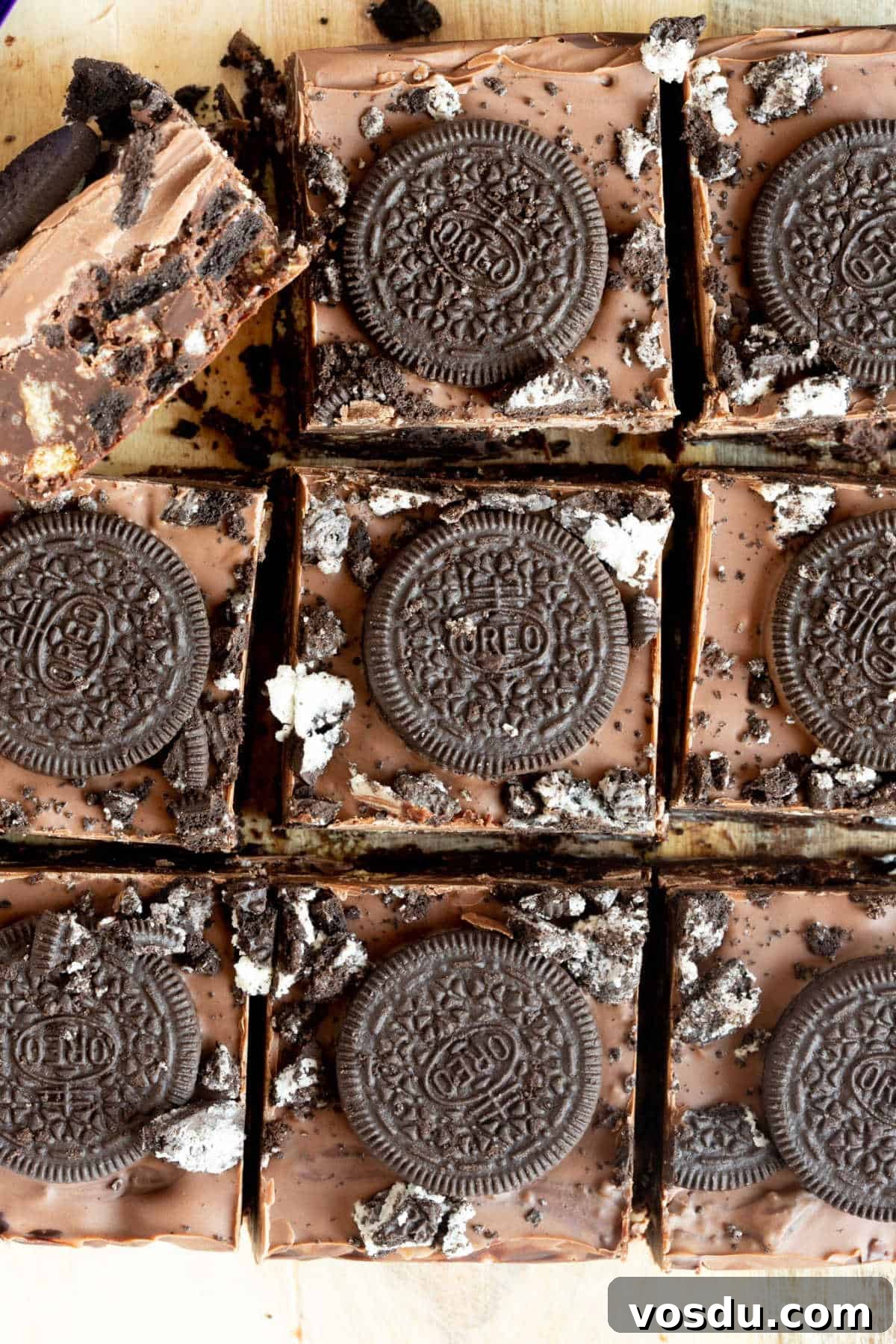 No-Bake Chocolate Oreo Tiffin Recipe — Quick No-Bake Dessert 2 Oreo tiffin bars on a wooden board.