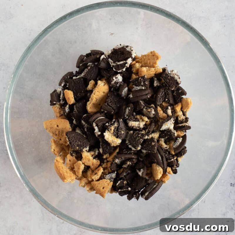 No-Bake Chocolate Oreo Tiffin Recipe — Quick No-Bake Dessert 4 Crushed Oreos and digestives in a bowl.