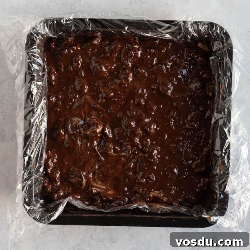 No-Bake Chocolate Oreo Tiffin Recipe — Quick No-Bake Dessert 7 Tiffin in a square tin.