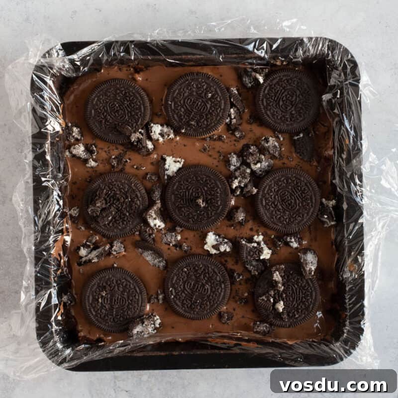 No-Bake Chocolate Oreo Tiffin Recipe — Quick No-Bake Dessert 8 Oreo tiffin in a square tin.