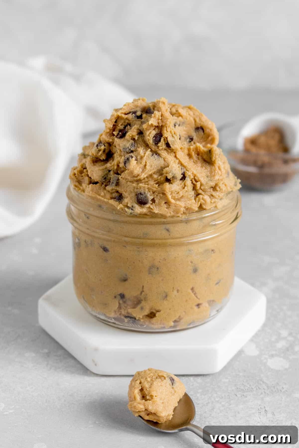 Edible Chocolate Chip Cookie Dough Recipe You Can Eat Raw 2 A jar overflowing with edible chocolate chip cookie dough.
