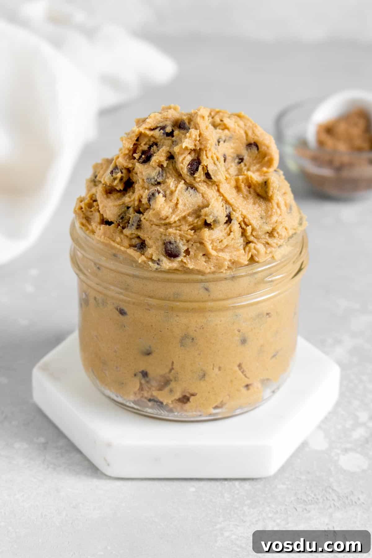 Edible Chocolate Chip Cookie Dough Recipe You Can Eat Raw 3 A jar overflowing with edible chocolate chip cookie dough.