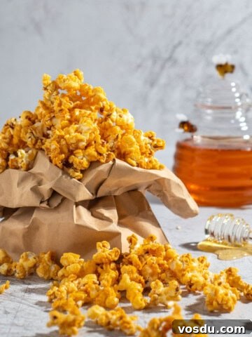 Honey popcorn in a brown paper bag.