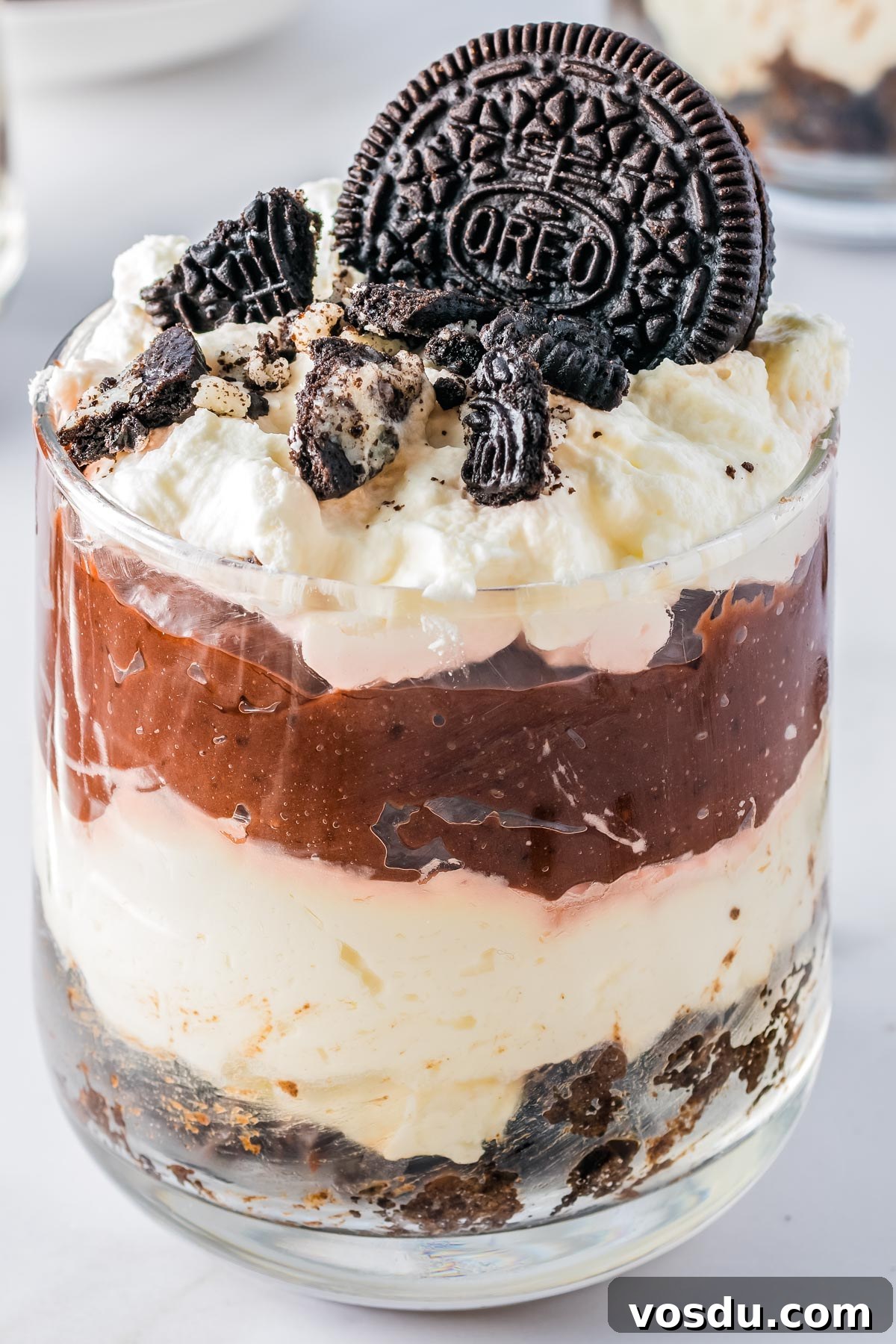 An Oreo parfait in a clear glass. 