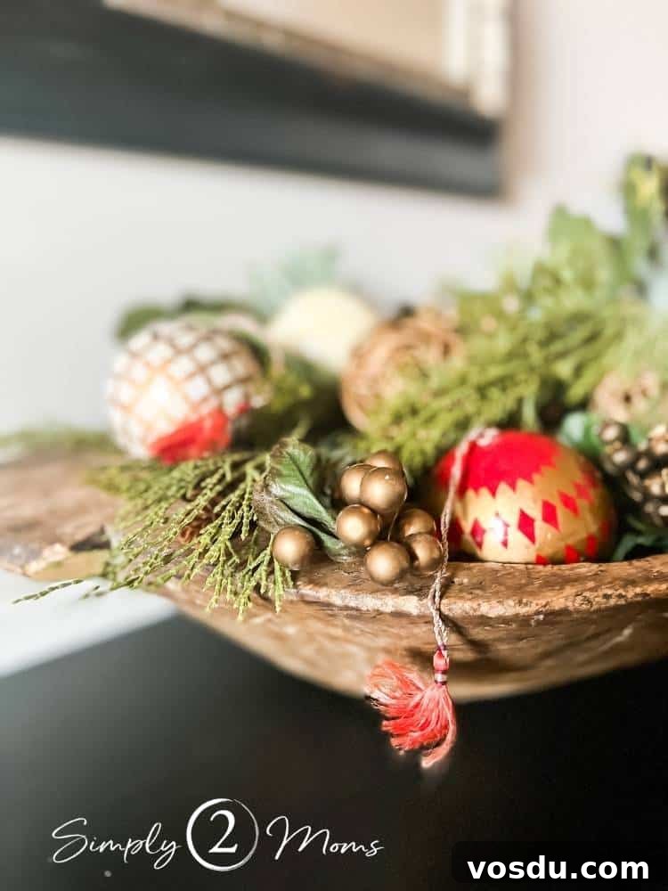 Country Chic Christmas Home Tour That Inspires Holiday Decorating 12 Antique dough bowl filled with faux greenery and painted red and cream Christmas ornaments