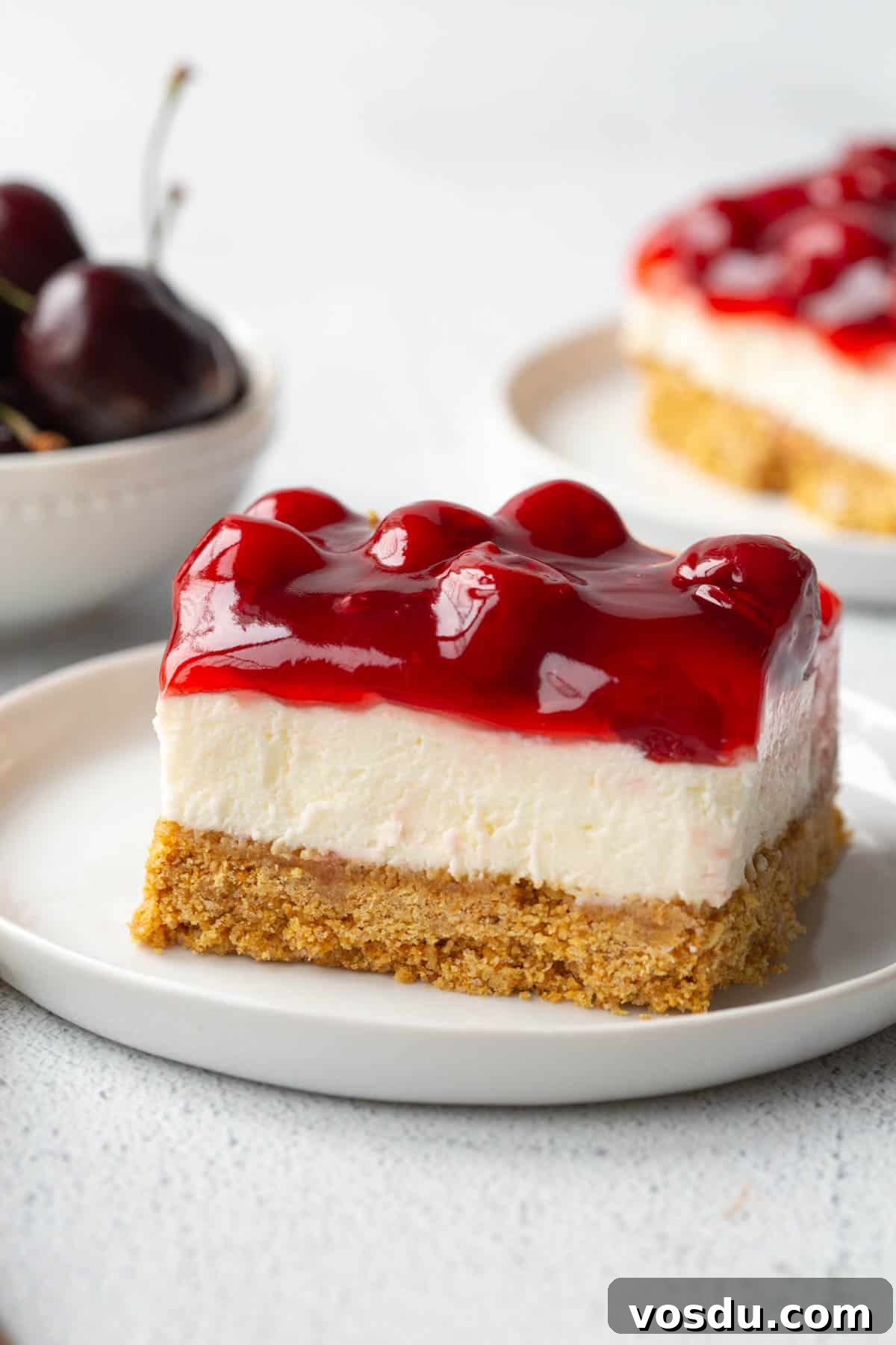 Cherry Delight: Homemade Cherry Dessert Recipes for Summer 2 slice of cherry delight on a white plate.