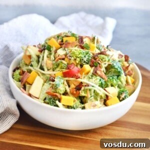 Broccoli Salad with Greek Yogurt Dressing – Light and Creamy 7 broccoli salad mixed together in white bowl.