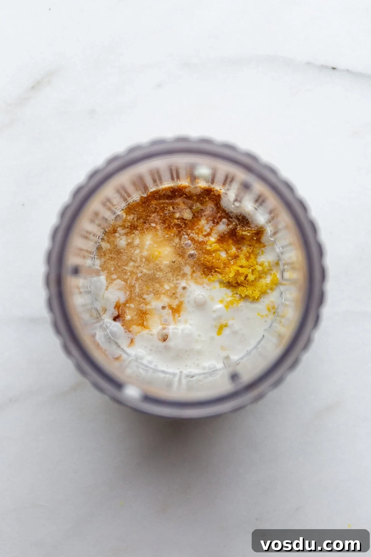Creamy Lemon Chia Pudding Recipe for Bright Morning Meals 4 cottage cheese, coconut milk, lemon zest and lemon in a blender container.