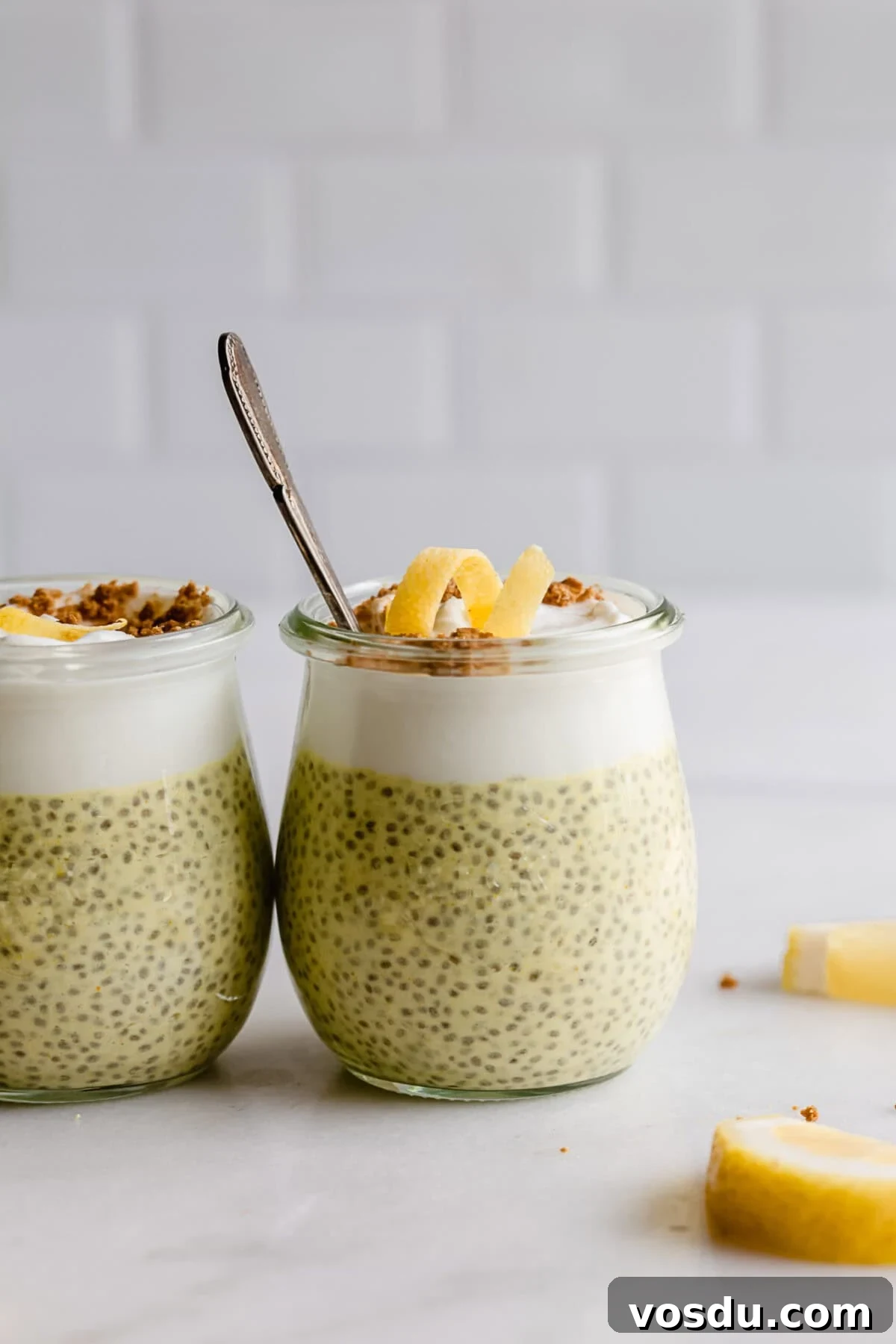 Creamy Lemon Chia Pudding Recipe for Bright Morning Meals 9 two cups of lemon chia pudding topped with yogurt and lemon zest.