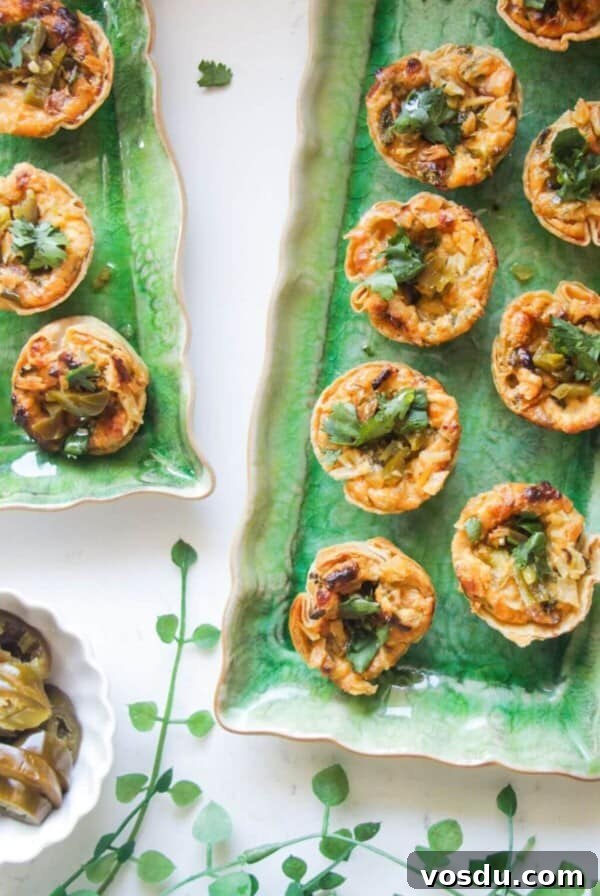 Blue Cheese, Prosciutto & Sweet Chili Filo Cups Recipe 11 Jalapeno popper taco cups on a green rectangular plate.