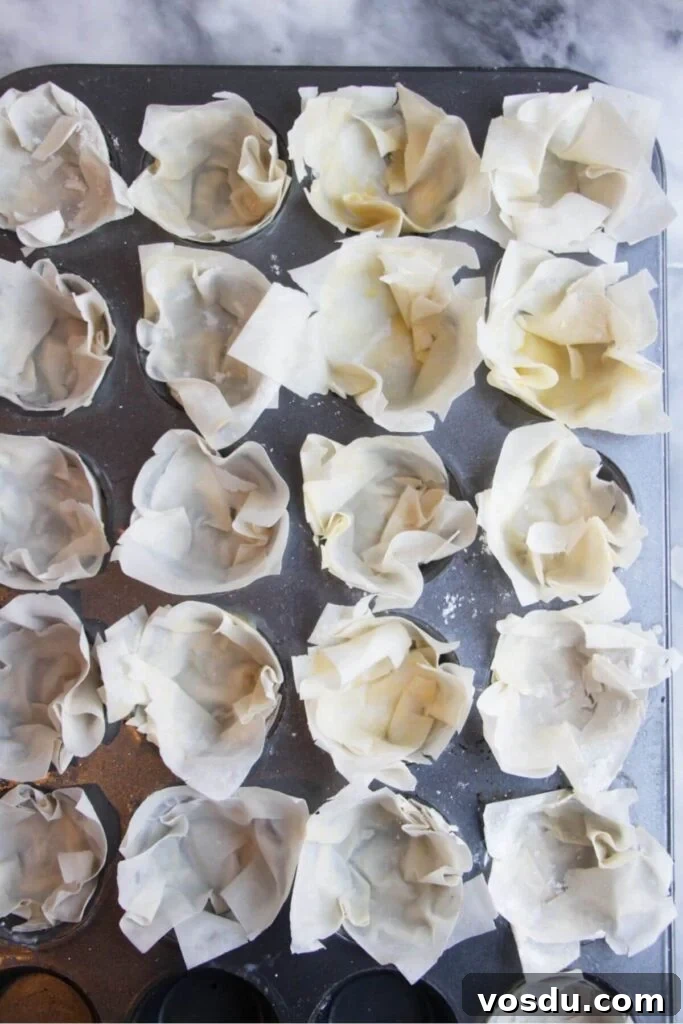 Blue Cheese, Prosciutto & Sweet Chili Filo Cups Recipe 5 Squares of filo pastry pressed into s mini muffin tin.