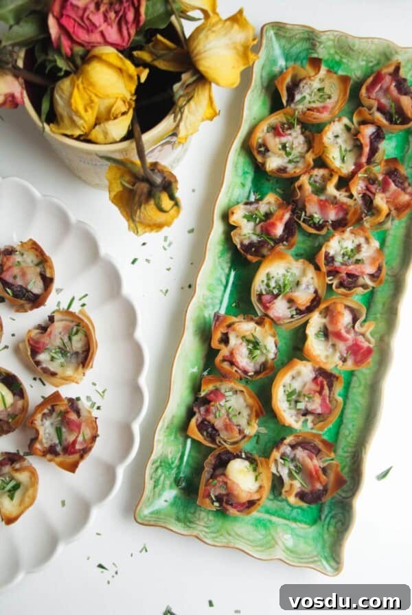 Blue Cheese, Prosciutto & Sweet Chili Filo Cups Recipe 8 Caramelized onion filo bites on a green plate.