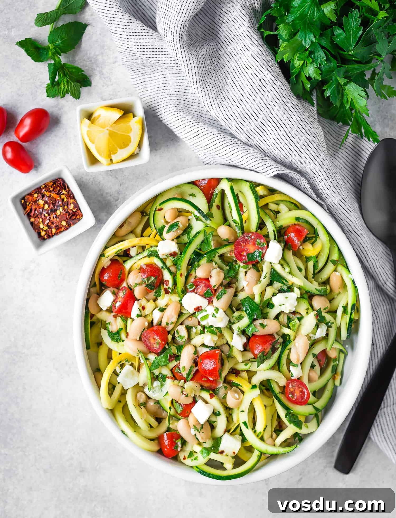 Zucchini Noodle Salad with White Beans, Feta & Lemon Vinaigrette 5 Overhead view of salad in serving bowl.