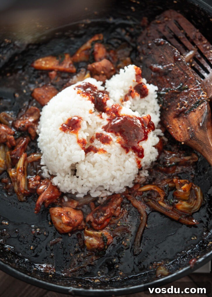 Dakgalbi Recipe: Spicy Korean Stir-Fried Chicken with Vegetables 10 Cooked rice added to leftover dakgalbi in a pan