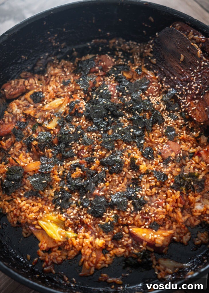 Dakgalbi Recipe: Spicy Korean Stir-Fried Chicken with Vegetables 11 Roasted seaweed and sesame seeds added to fried rice