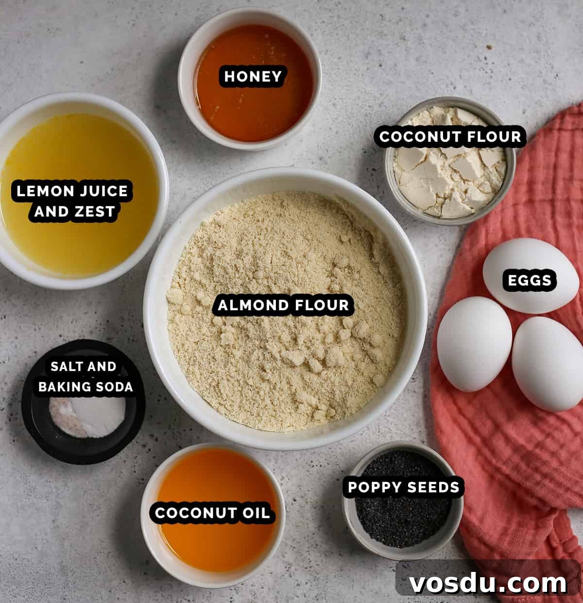 All the ingredients for paleo lemon poppy seed bread in individual bowls, labeled.