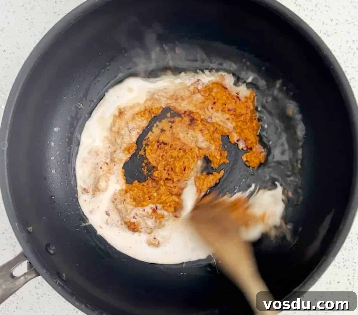 Malaysian Ayam Masak Merah Recipe: Flavorful Red Chicken Dish 4 How to make Ayam Masak Merah - Fry the rempah with coconut milk