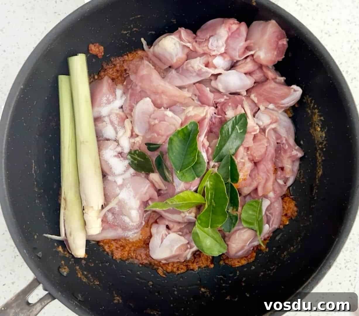 Malaysian Ayam Masak Merah Recipe: Flavorful Red Chicken Dish 5 How to make Ayam Masak Merah - Add the chicken, lemongrass and kaffir lime leaves