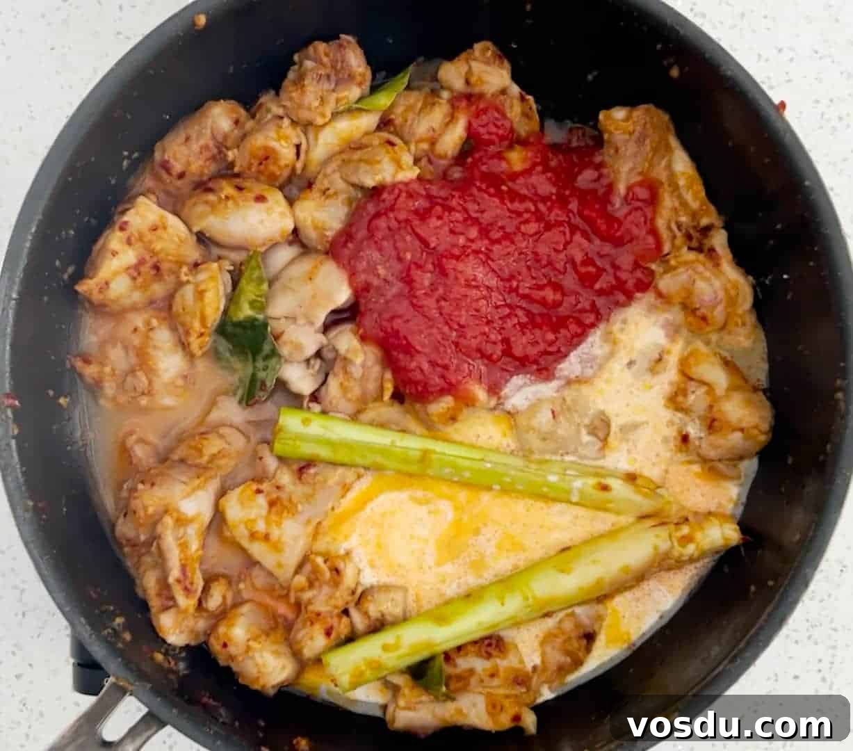 Malaysian Ayam Masak Merah Recipe: Flavorful Red Chicken Dish 6 How to make Ayam Masak Merah - add the tomato, coconut milk and water
