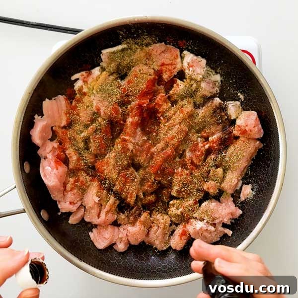 Maple Sage Ground Turkey Breakfast Sausage Recipe – Juicy & Flavorful 5 Adding all the seasonings to the ground turkey sausage in a skllet.
