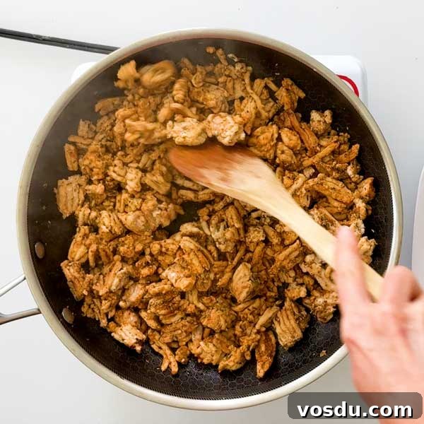 Maple Sage Ground Turkey Breakfast Sausage Recipe – Juicy & Flavorful 6 Mixing the ground turkey sausage with a spatula