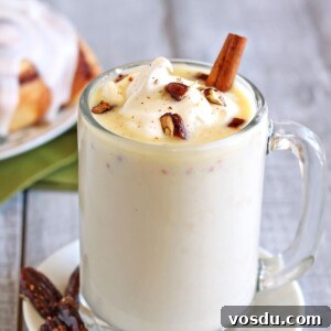 Decadent Raspberry White Hot Chocolate Recipe 2 Cup of Cinnamon Bun White Hot Chocolate on a small white plate.