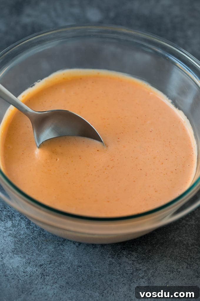 Fry Sauce Recipe #sauce #dinneratthezoo Mayonnaise, ketchup and spices mixed together in a bowl.