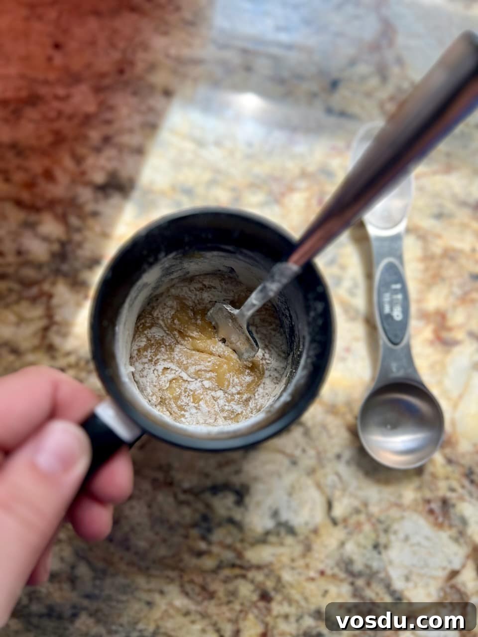 Sourdough Mug Cookie Recipe: Quick Single-Serve Treat 5 Adding flour to the mug and stirring to form a thick cookie dough.