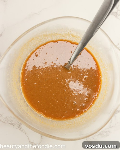 Keto Payday Candy Bar Recipe: Low-Carb Payday-Style Treat 9 Mixing the caramel for making payday bars.