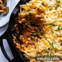 overhead shot of shepherds pie with a scoop taken out.