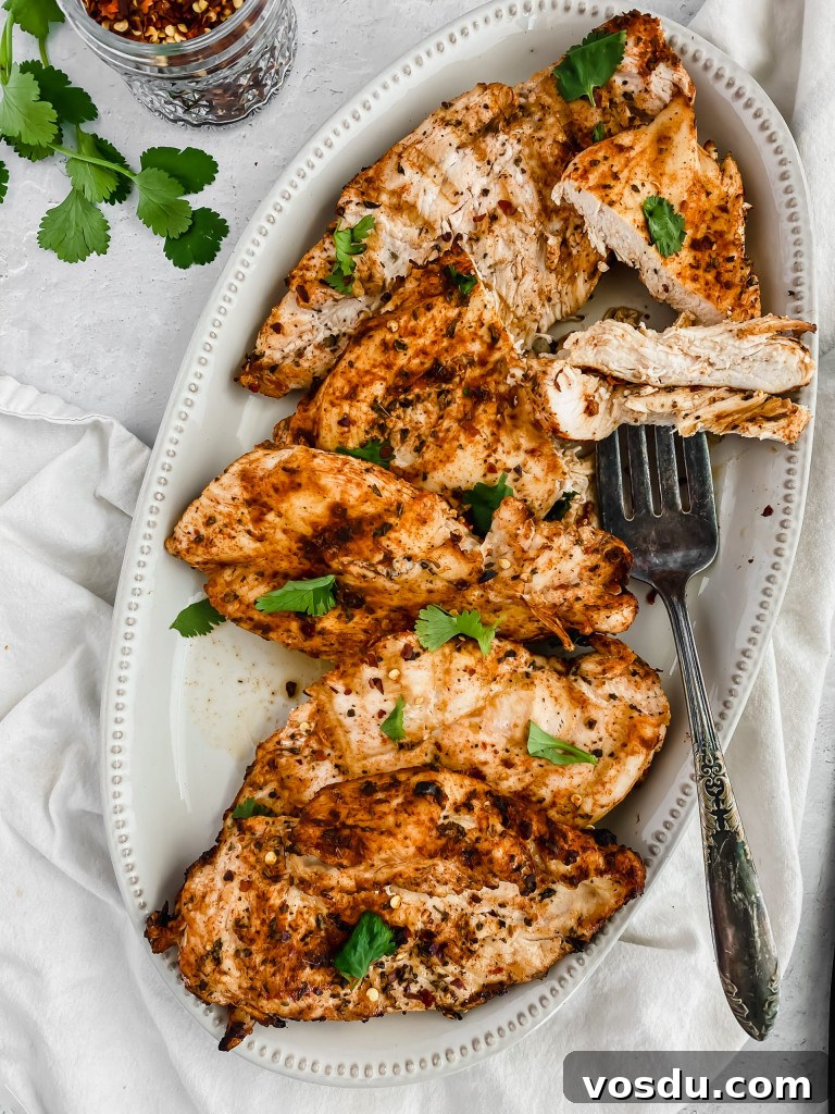 Readers' Top 10 Favorite Recipes of 2022 11 A platter filled with grilled chicken breasts showing juicy texture