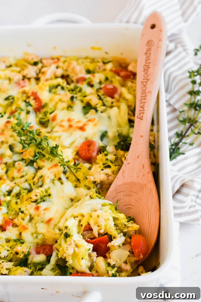 Readers' Top 10 Favorite Recipes of 2022 8 Large white baking dish with spaghetti squash feta cheese casserole with wooden spoon