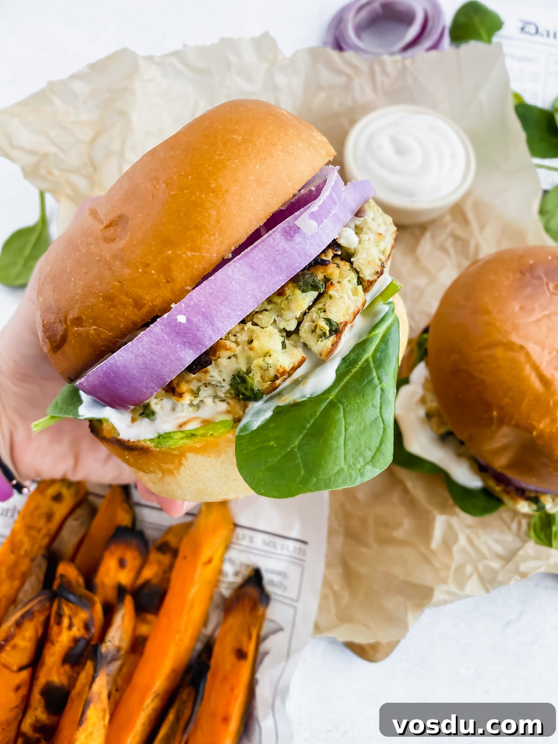 Readers' Top 10 Favorite Recipes of 2022 9 close up hand holding fully loaded turkey burger
