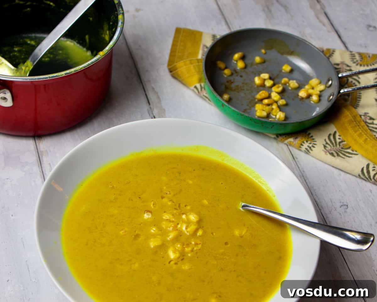 Spiced Pumpkin & Sweetcorn Soup Recipe for Cozy Fall Nights 4 Bowl of pumpkin and sweetcorn soup with roasted sweetcorn bits on top
